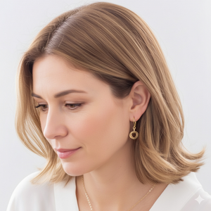 Woman wearing petite gold love knot leverback earrings